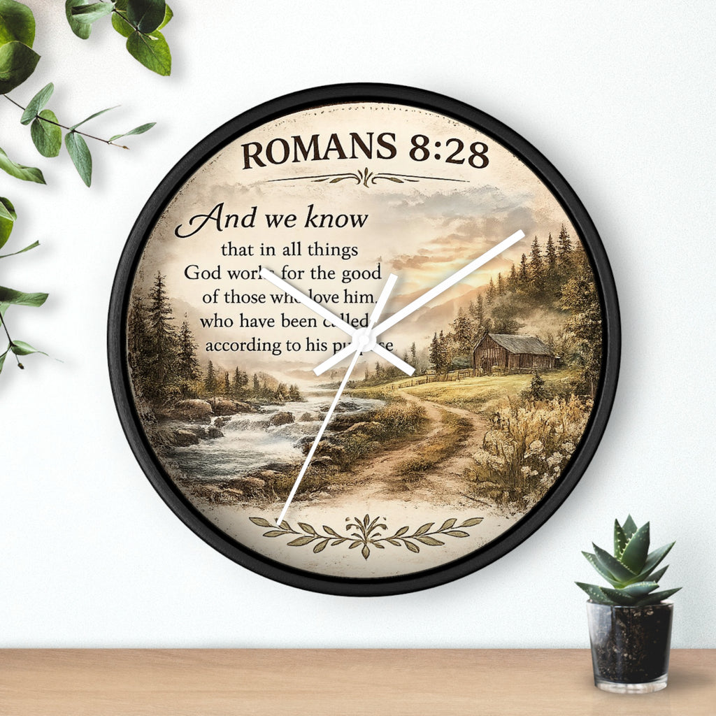 Inspirational Christian wall clock featuring Romans 8:28 scripture with a rustic cabin, flowing creek, and sunset landscape in warm countryside colors.