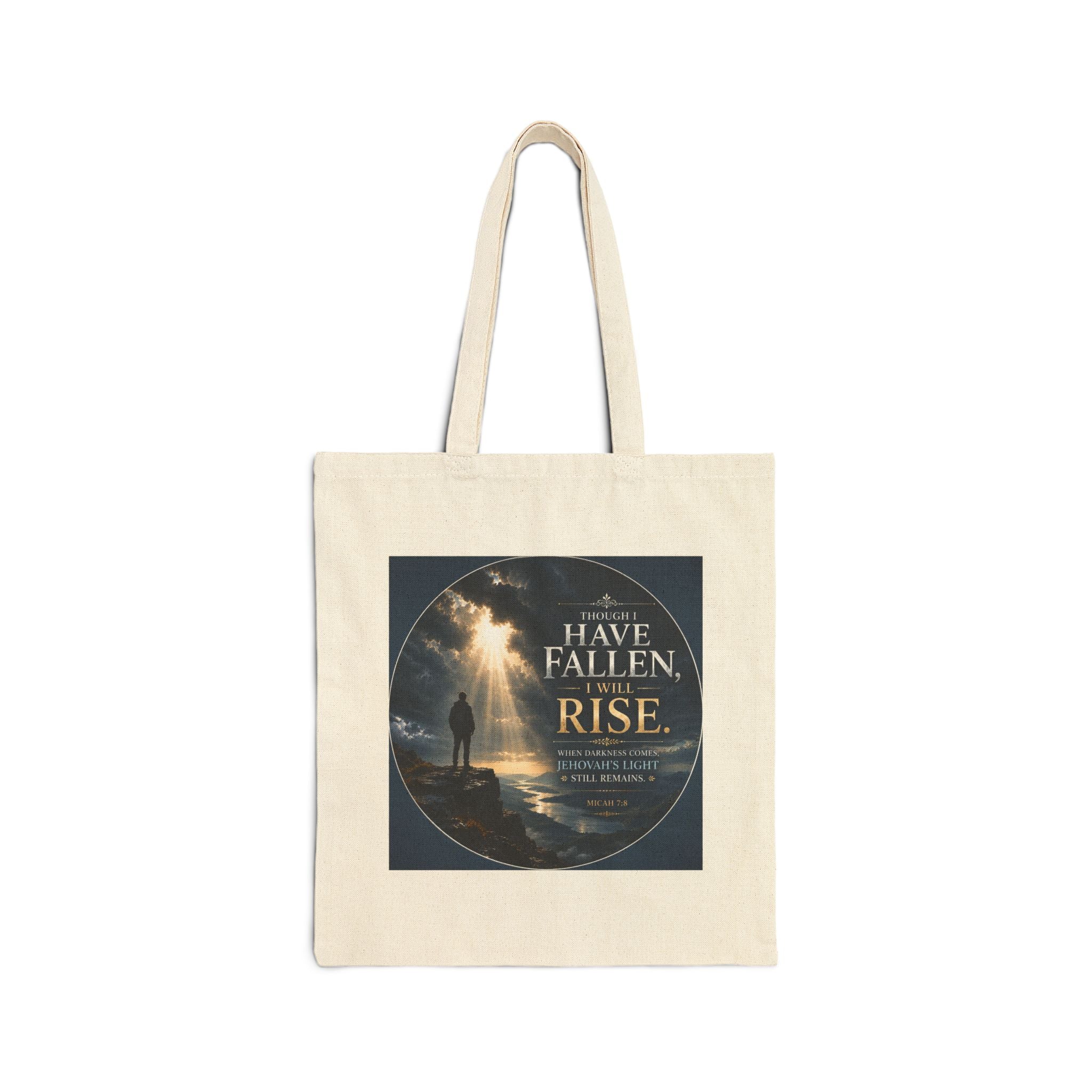 Christian cotton canvas tote bag featuring Micah 7:8 and the message “Though I Have Fallen, I Will Rise,” with dramatic mountain landscape artwork, storm clouds, rays of light, and inspirational faith-based design.