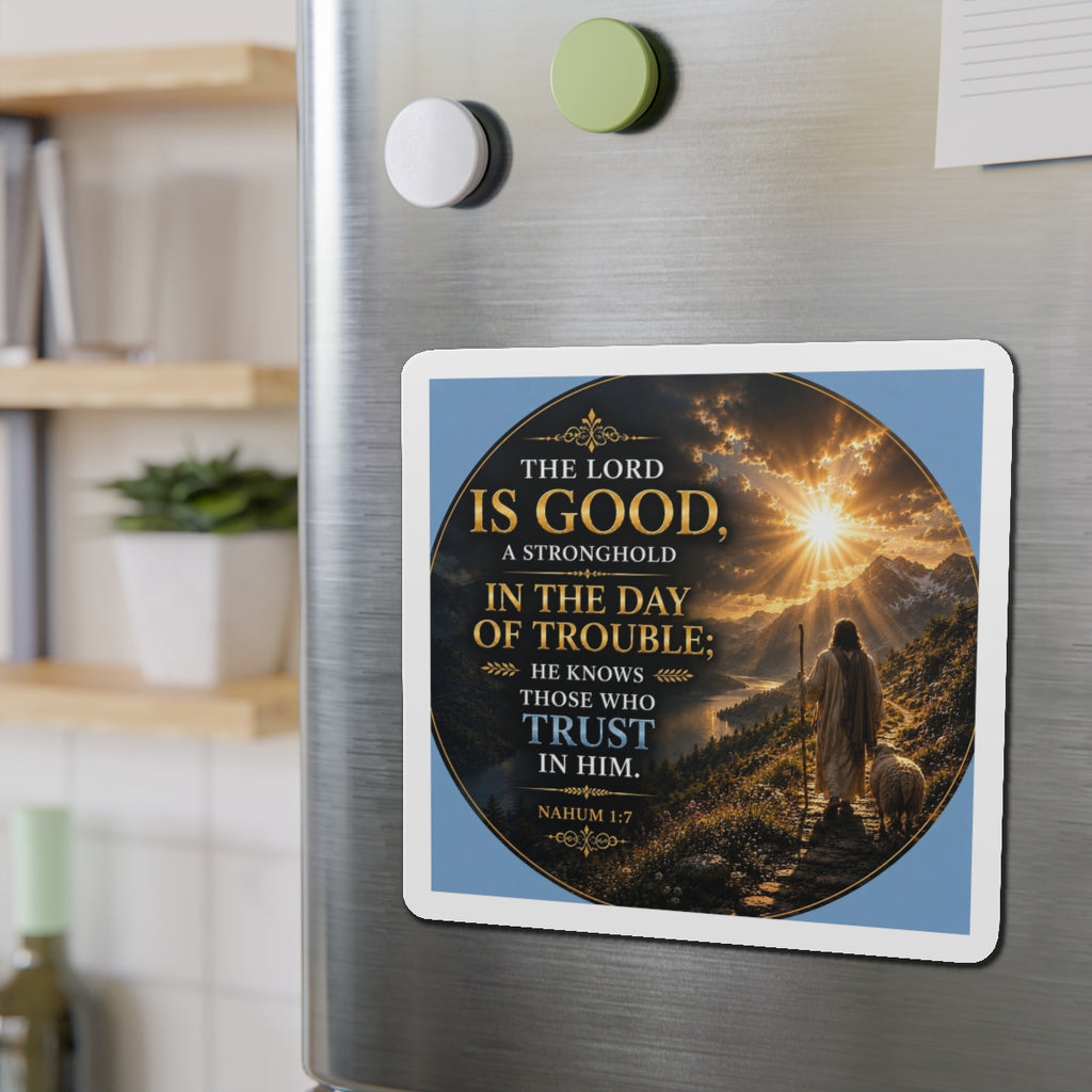 Fridge magnet with a religious quote and illustration on a metallic surface.