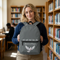 Gray Christian backpack featuring a white dove carrying a heart beneath the words "Jesus Is Peace," with multiple zippered compartments and padded shoulder straps.