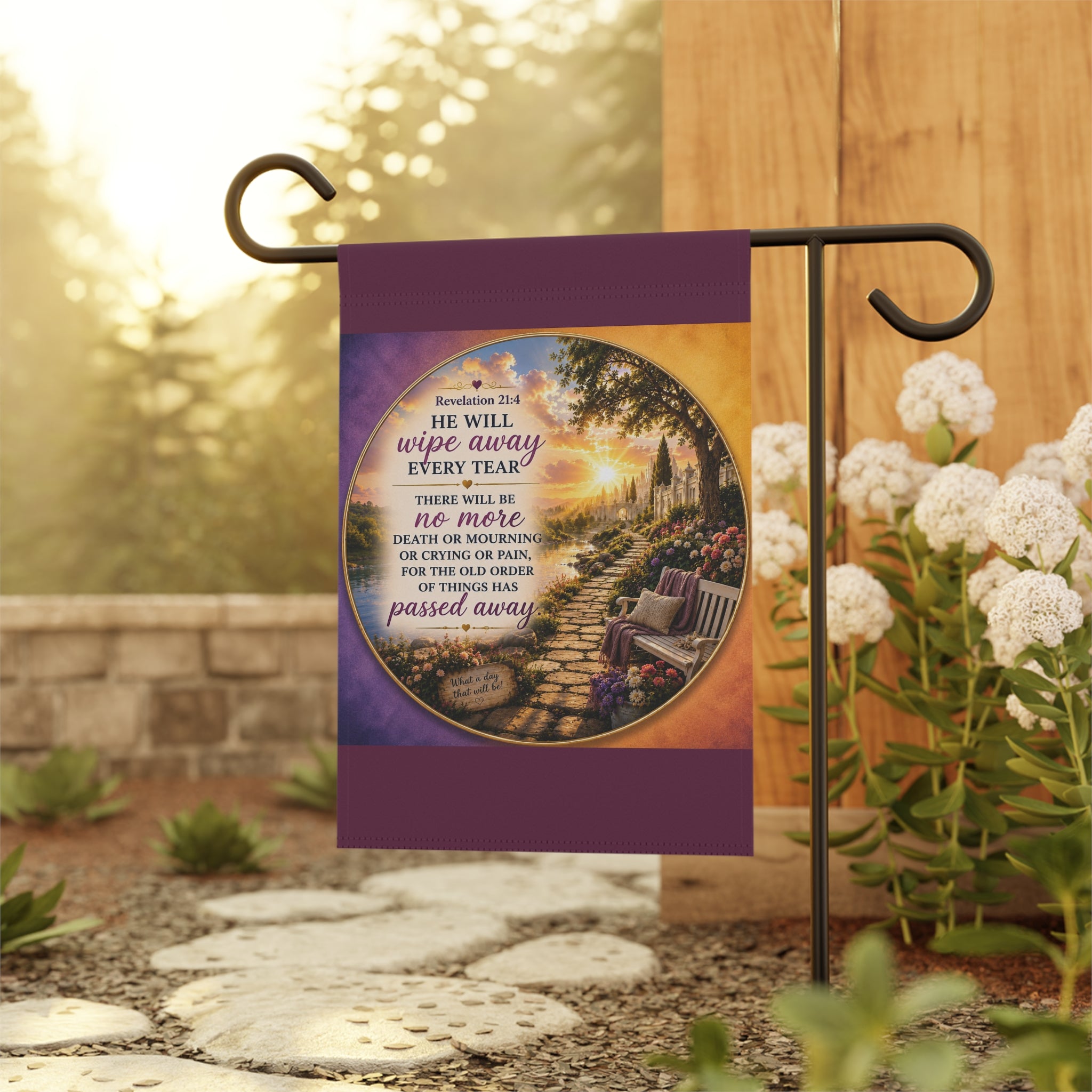 Inspirational Christian garden flag featuring a peaceful sunset garden path and bench with Revelation 21:4 scripture “He Will Wipe Away Every Tear” in warm glowing tones.