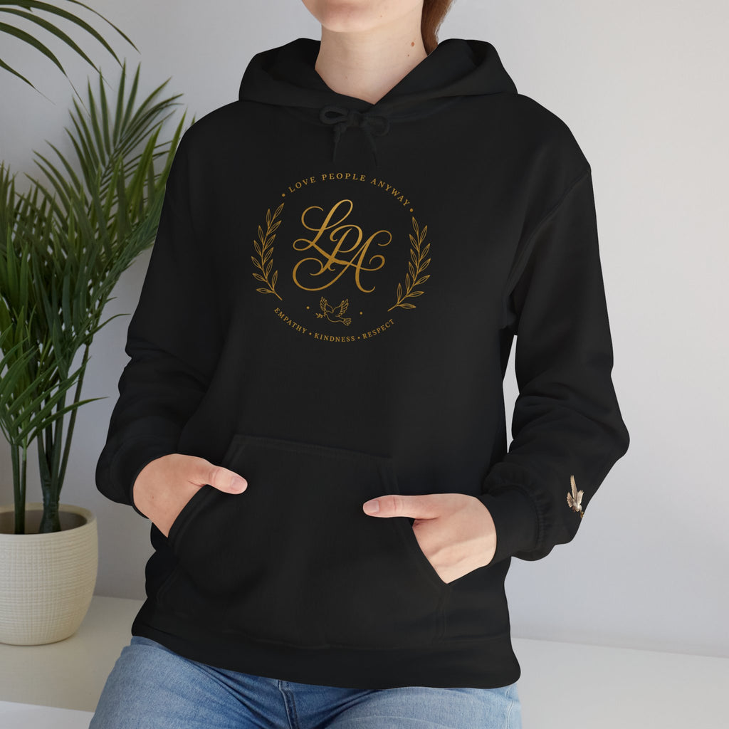 Inspirational Christian hoodie featuring elegant “Love People Anyway” script typography on a soft, cozy hooded sweatshirt designed to encourage kindness and compassion.