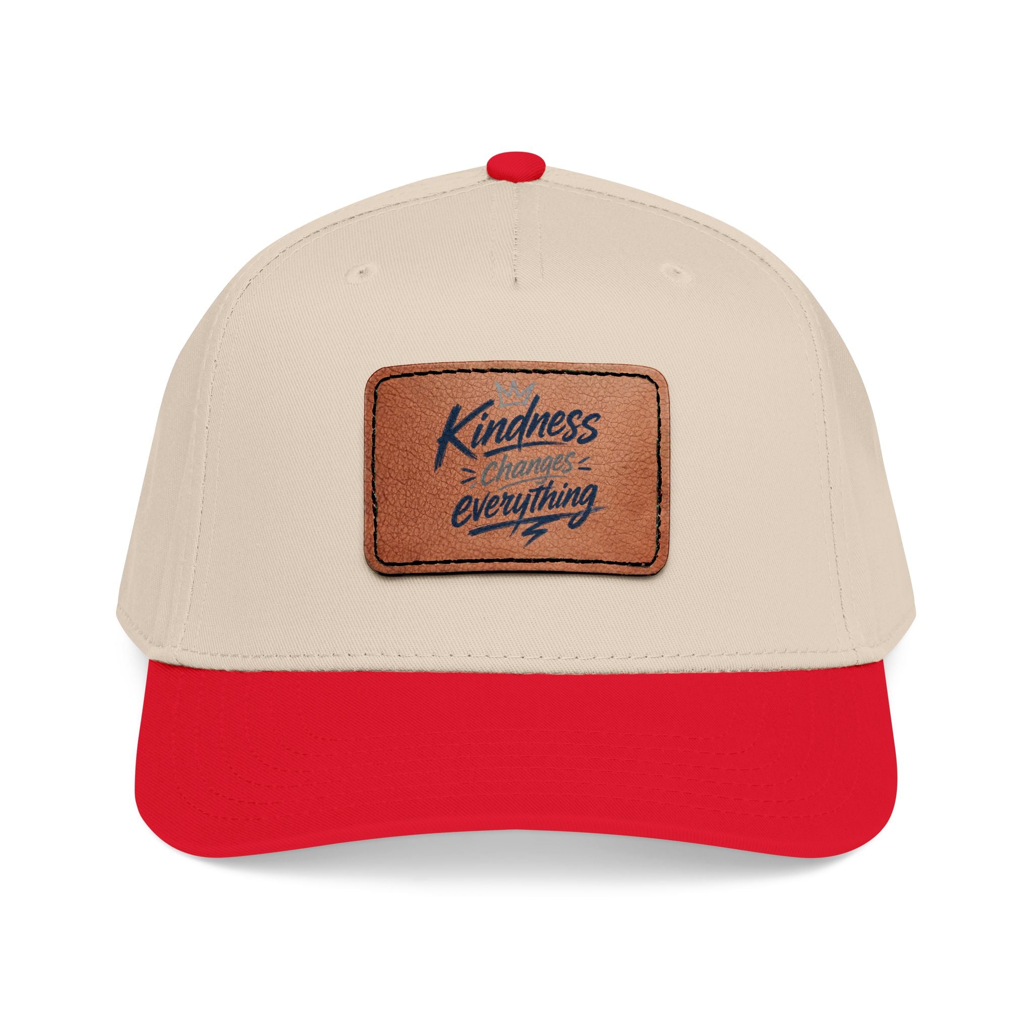 Vintage-inspired baseball cap featuring a brown leather patch with the phrase “Kindness Changes Everything” on a structured mid-profile snapback hat.