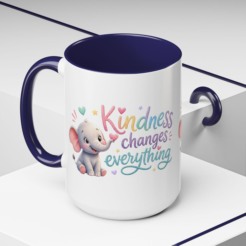 Cute ceramic coffee mug featuring a pastel baby elephant and the uplifting message “Kindness Changes Everything” with colorful accent handle and interior.