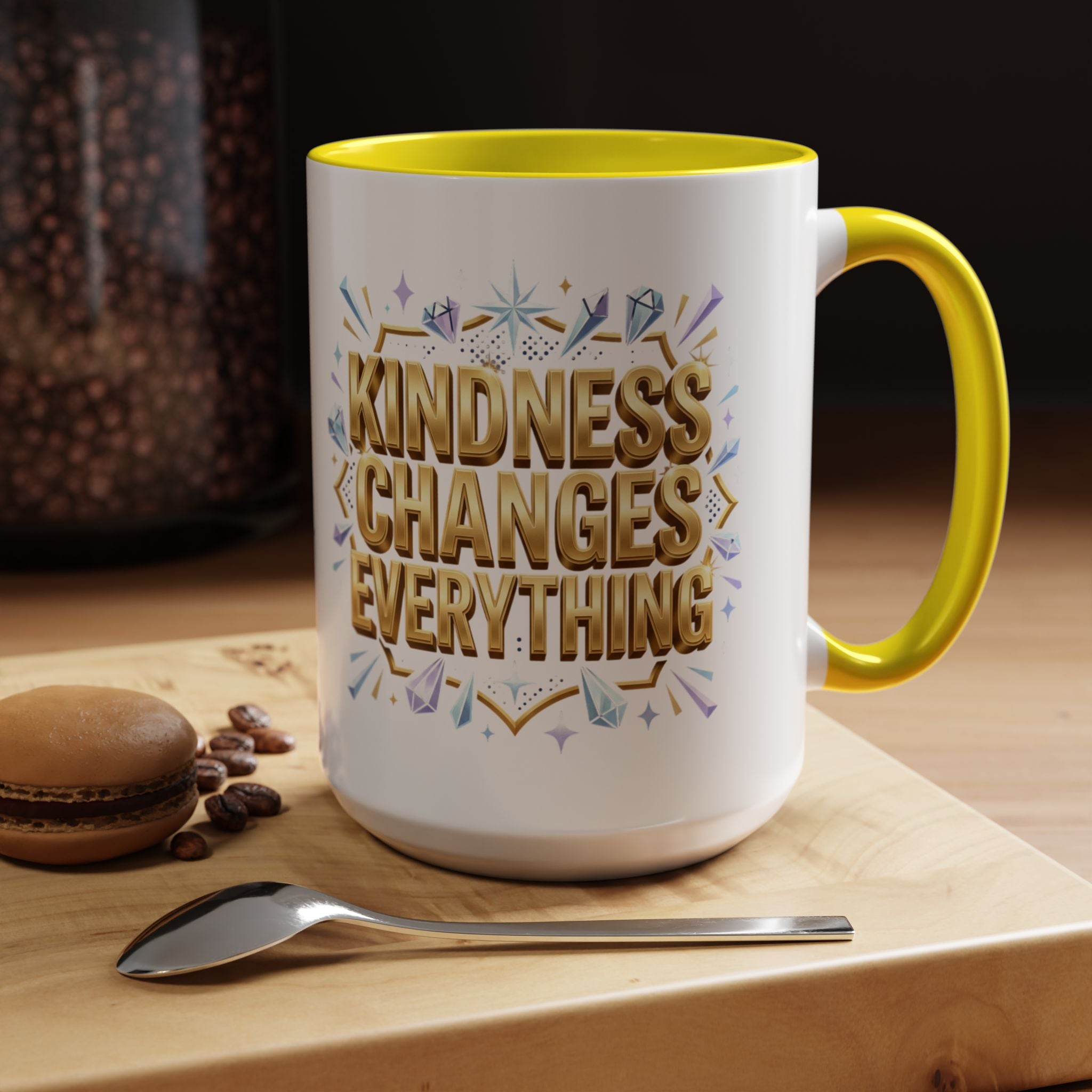 Inspirational ceramic accent coffee mug featuring “Kindness Changes Everything” in elegant gold script with sparkles and colorful accent handle and interior.