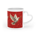 White ceramic heart-shaped handle mug featuring a graceful white dove carrying an olive branch on a vibrant sparkling red background with wraparound artwork.