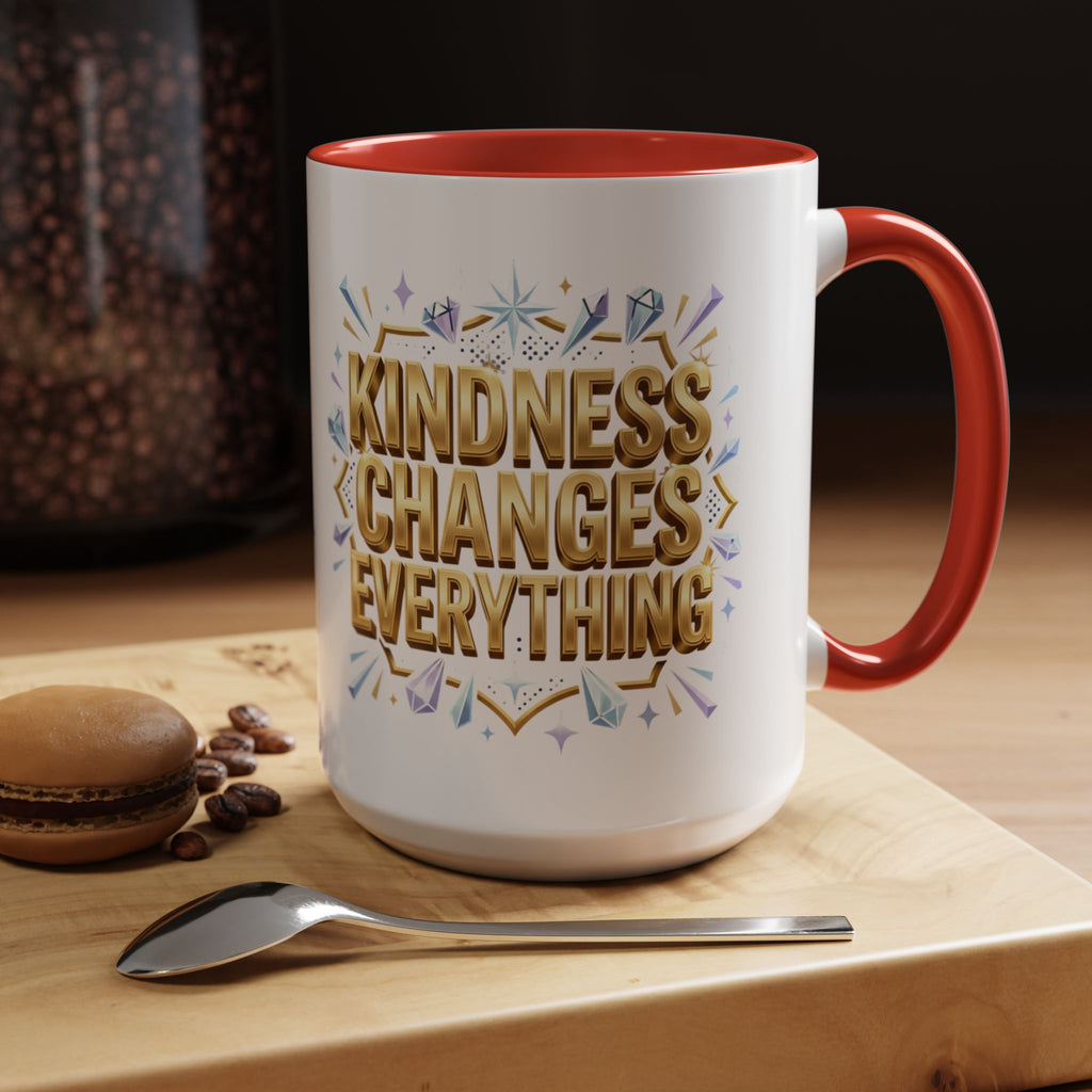 Inspirational ceramic accent coffee mug featuring “Kindness Changes Everything” in elegant gold script with sparkles and colorful accent handle and interior.