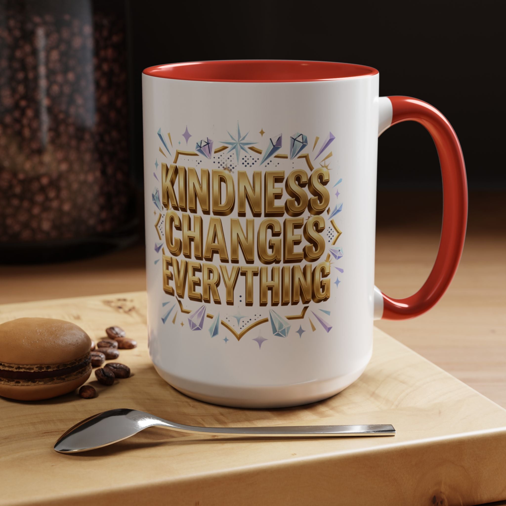 Inspirational ceramic accent coffee mug featuring “Kindness Changes Everything” in elegant gold script with sparkles and colorful accent handle and interior.