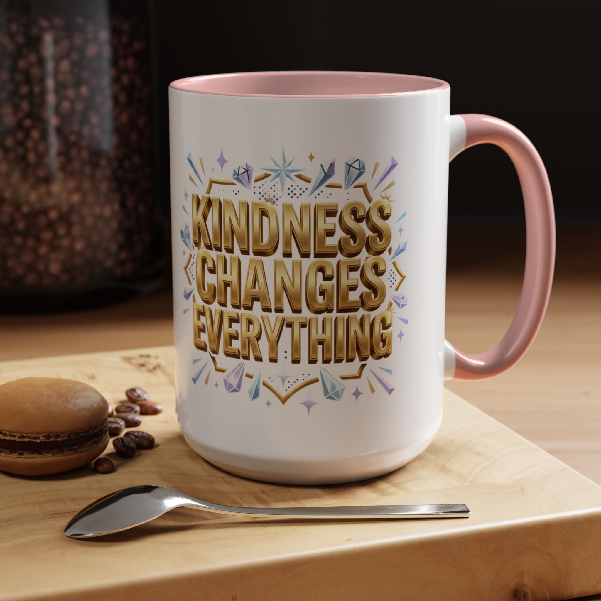Inspirational ceramic accent coffee mug featuring “Kindness Changes Everything” in elegant gold script with sparkles and colorful accent handle and interior.