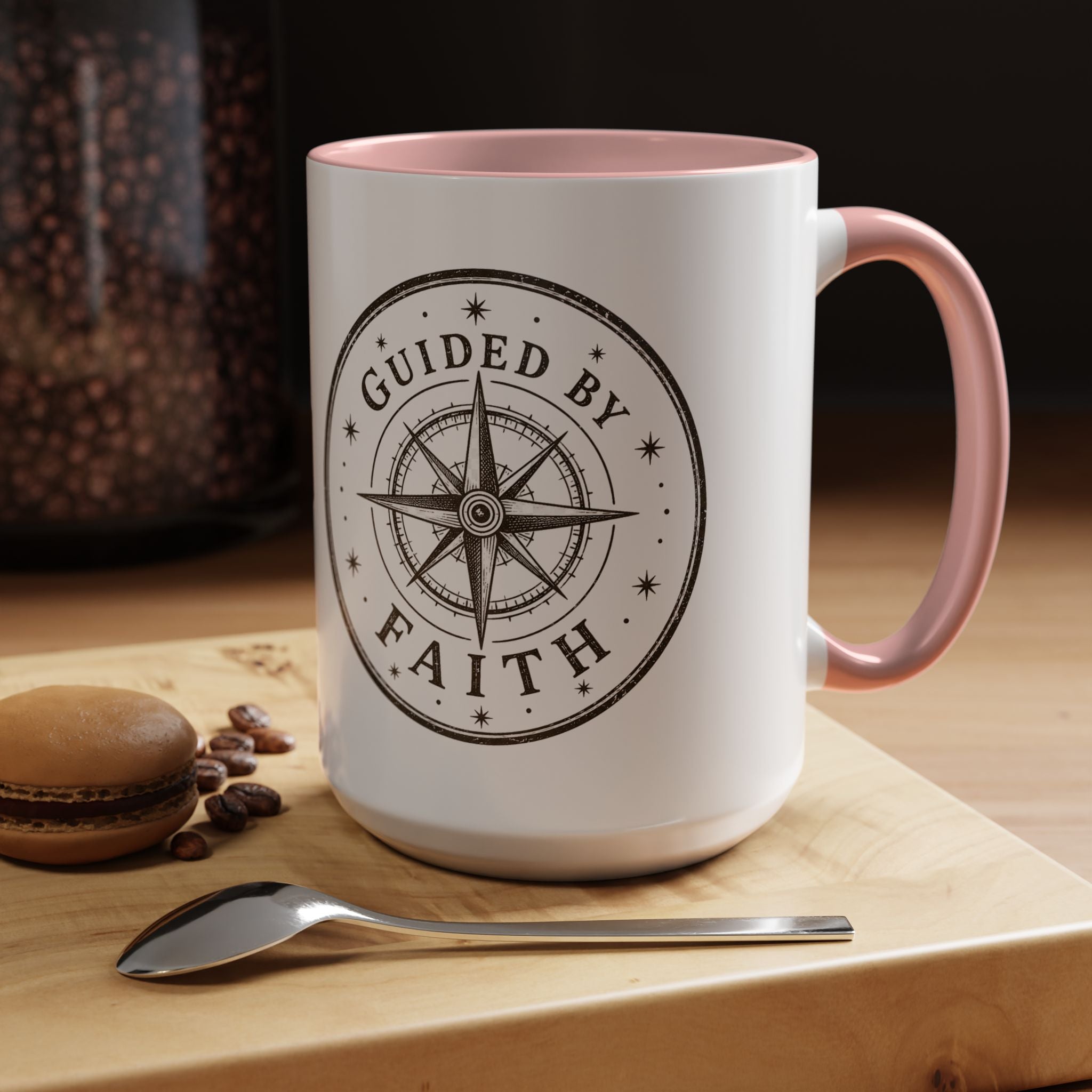 Inspirational ceramic accent coffee mug featuring a compass design and “Guided by Faith” message with colorful handle and interior accents on a glossy white mug.