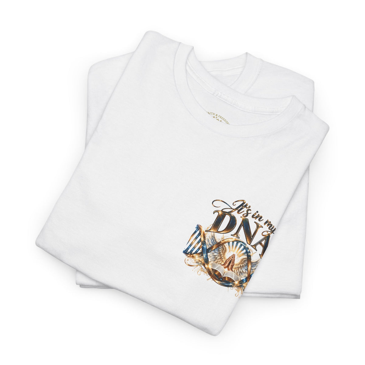 A folded white t-shirt with a graphic print on the front that reads 'It's in my DNA' in brown and gold lettering, accompanied by a stylized illustration of a 47-year-old man's face and a heart. The t-shirt is photographed on a seamless white background.