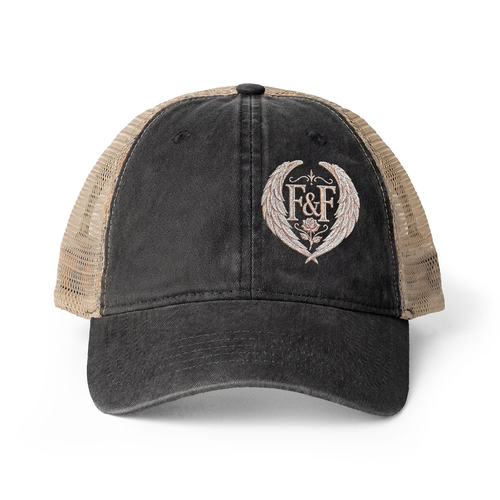 Women’s washed mesh-back cap featuring the Faith & Freedom logo with vintage styling, breathable mesh panels, and concealed ponytail opening.
