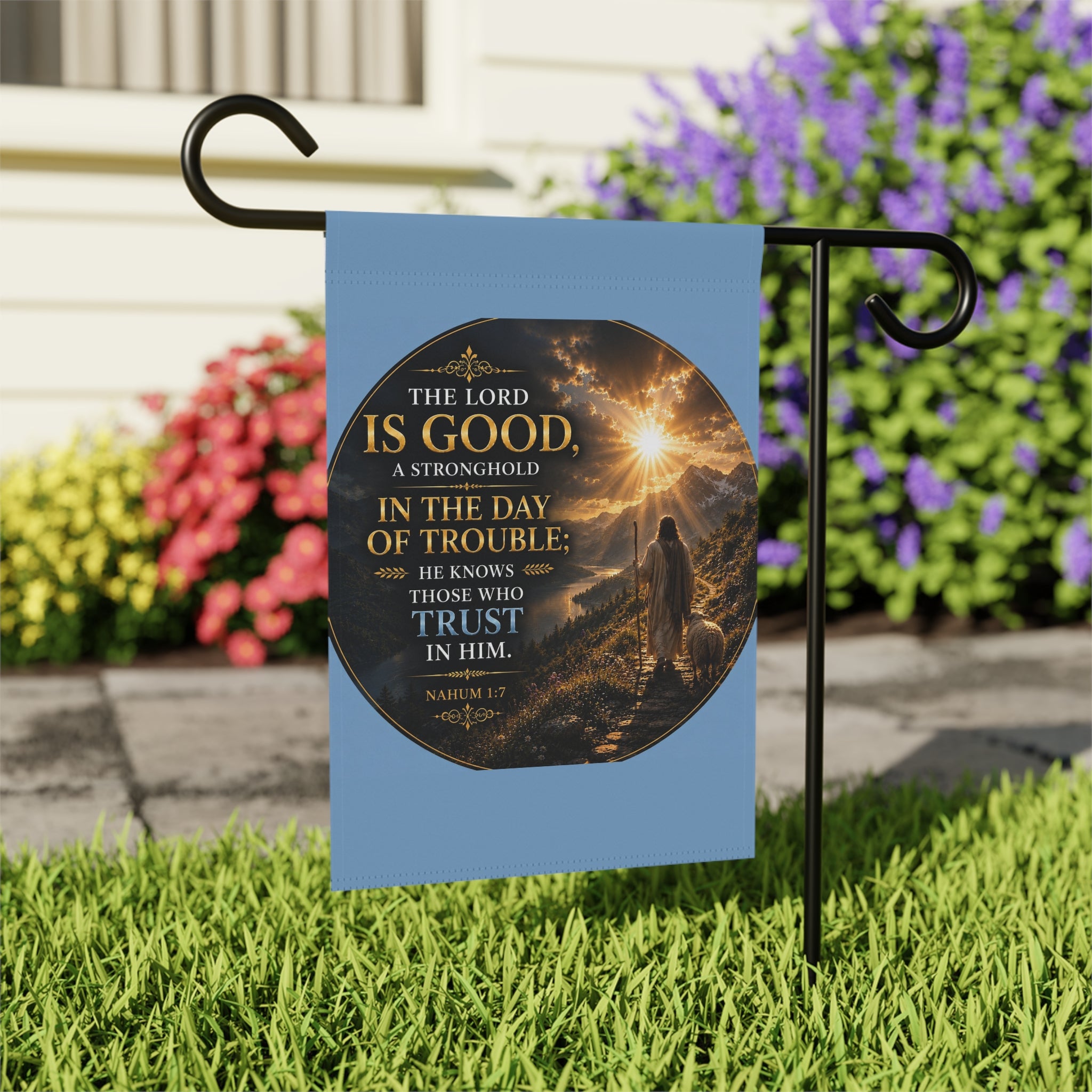 Inspirational Christian garden flag featuring a sunrise pathway scene with a lone figure walking toward golden light and “The Lord Is Good” scripture artwork.