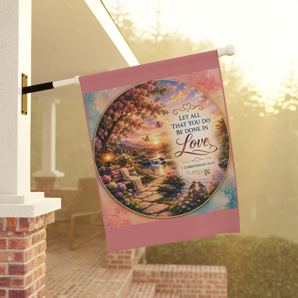 Inspirational Christian garden flag featuring a floral lakeside scene with hydrangeas, a sunlit pathway, and 1 Corinthians 16:14 scripture about love.