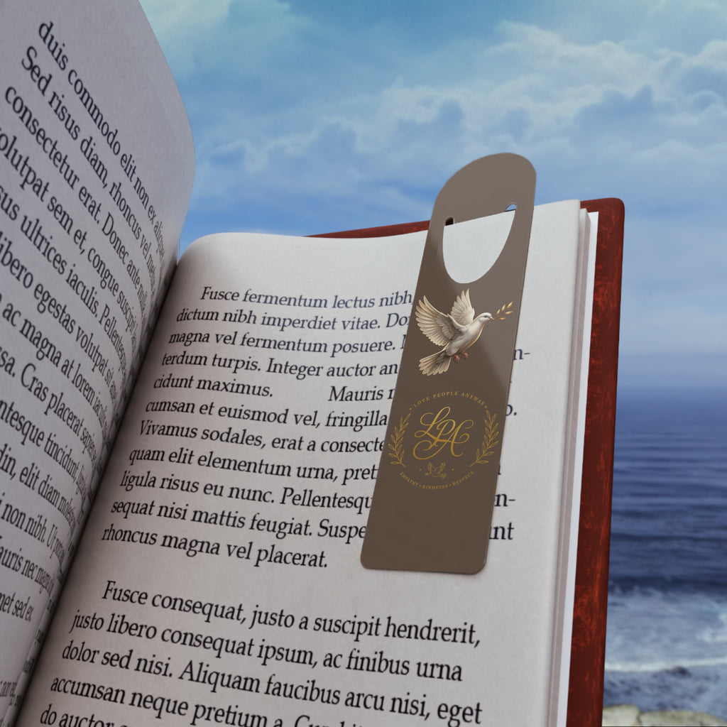 Personalized aluminum bookmark featuring a dove, laurel wreath, and custom monogram on a warm brown background with brushed metal backing and secure page-holding slot.