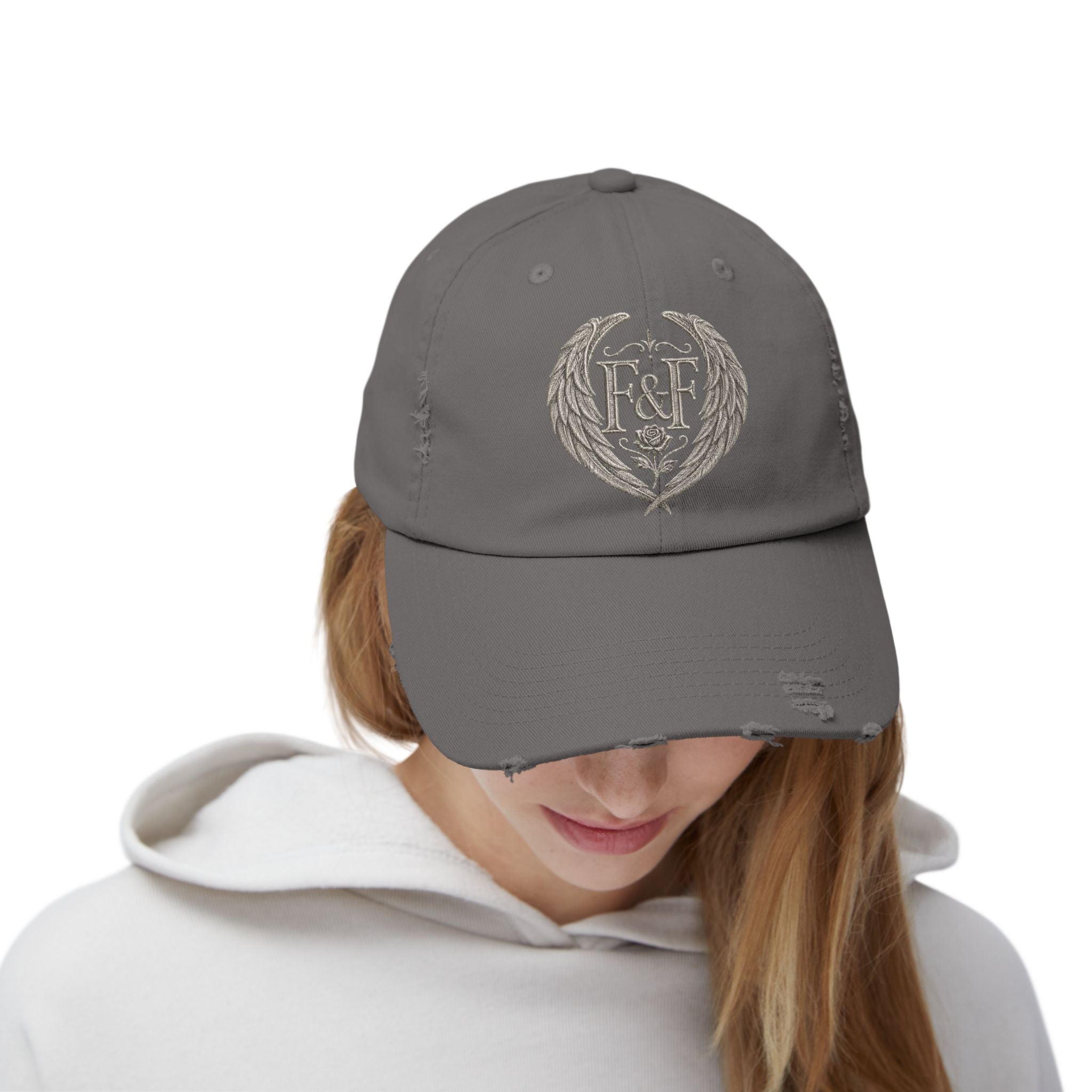 Distressed black Christian cap featuring the Faith & Freedom wing crest logo with feathered wings and vintage washed low-profile styling.