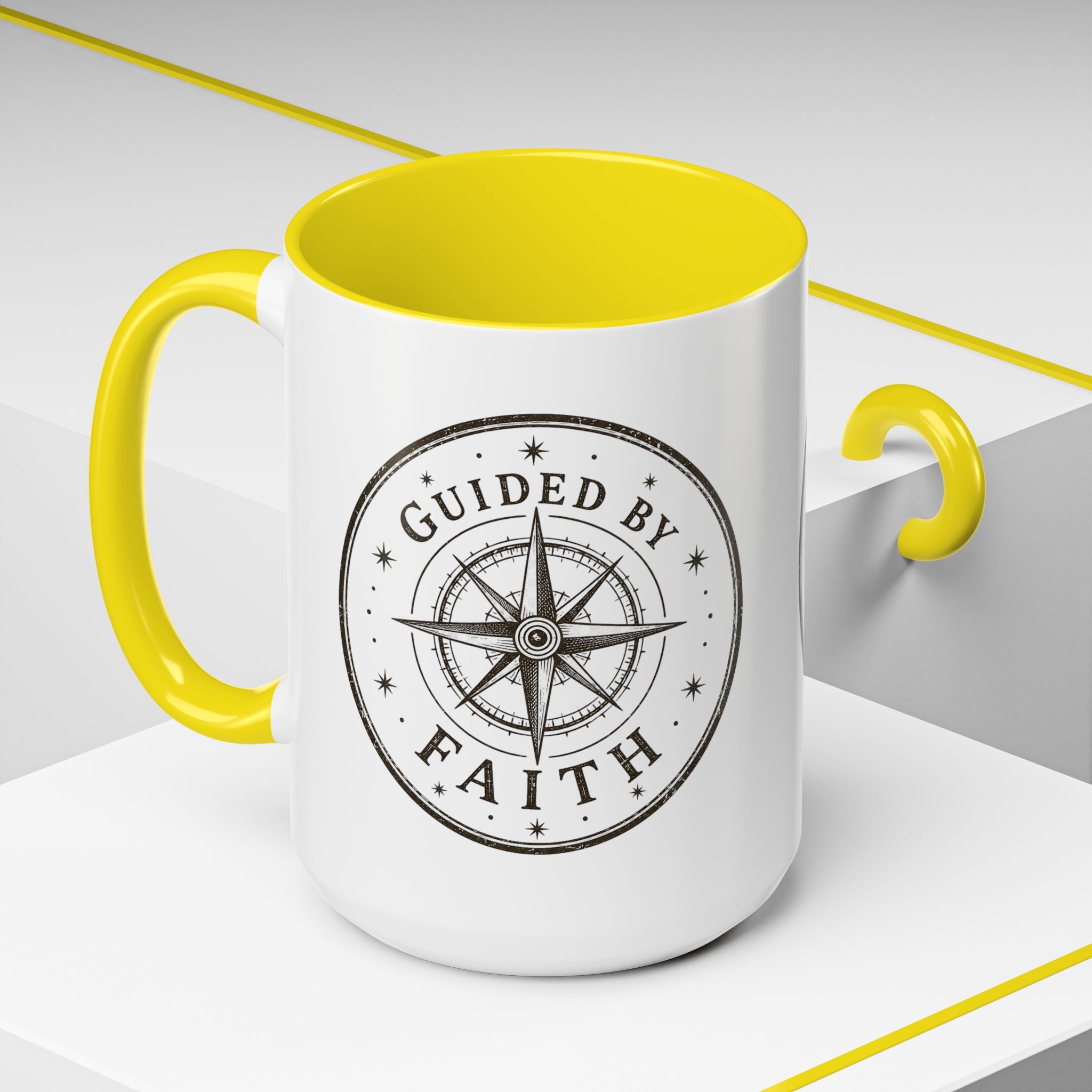 Inspirational ceramic accent coffee mug featuring a compass design and “Guided by Faith” message with colorful handle and interior accents on a glossy white mug.