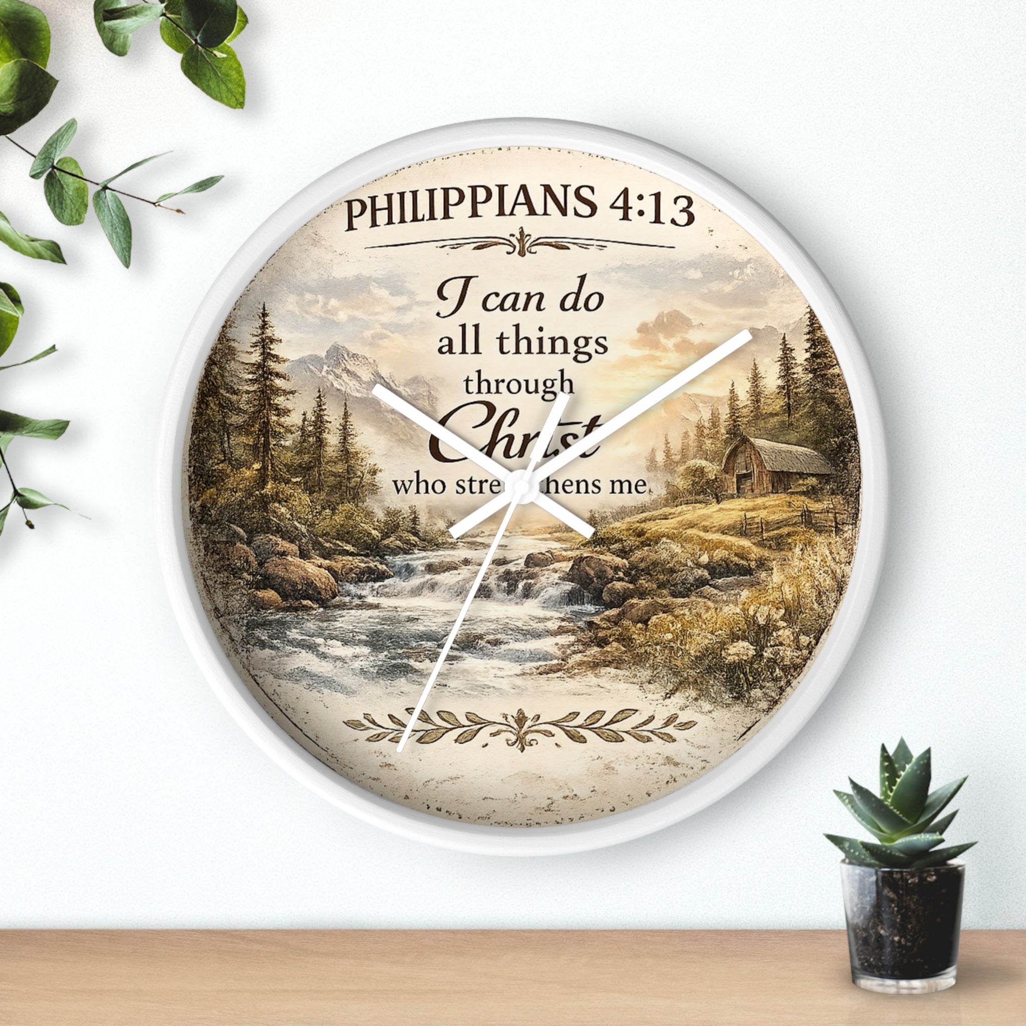 Inspirational Christian wall clock featuring Philippians 4:13 with a rustic cabin, flowing river, pine trees, and peaceful countryside landscape in warm vintage tones.