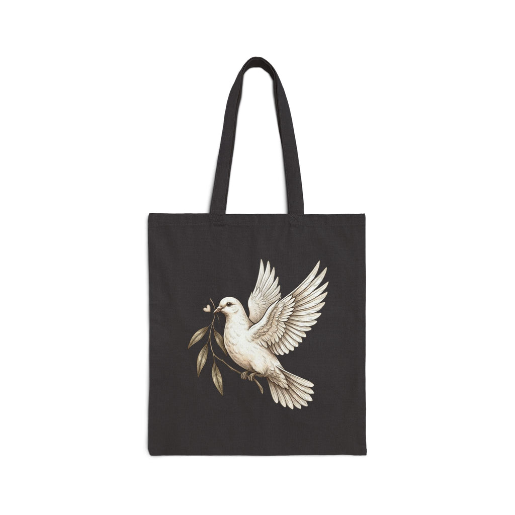 Cotton canvas tote bag featuring a vintage-style dove carrying an olive branch, symbolizing peace, hope, faith, and renewal in a rustic black-and-cream design.
