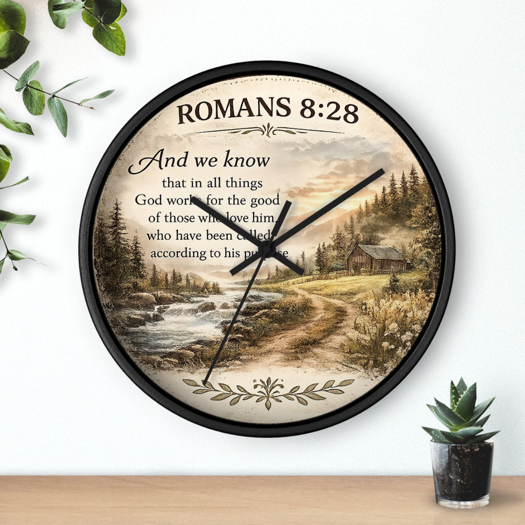 Inspirational Christian wall clock featuring Romans 8:28 scripture with a rustic cabin, flowing creek, and sunset landscape in warm countryside colors.