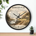 Inspirational Christian wall clock featuring Romans 8:28 scripture with a rustic cabin, flowing creek, and sunset landscape in warm countryside colors.