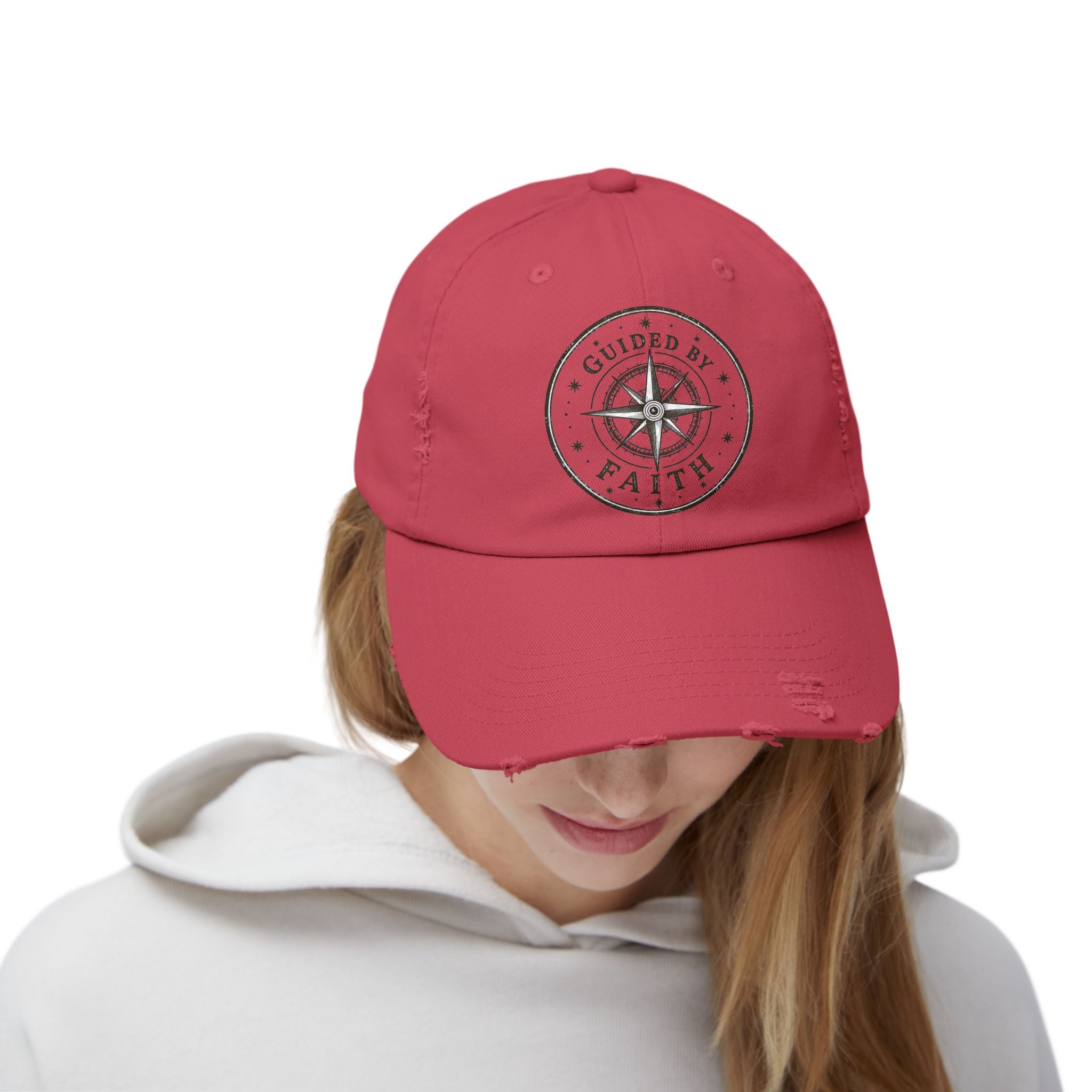 Vintage distressed Christian baseball cap featuring a compass emblem and the phrase “Guided by Faith” on a soft low-profile cotton twill hat.