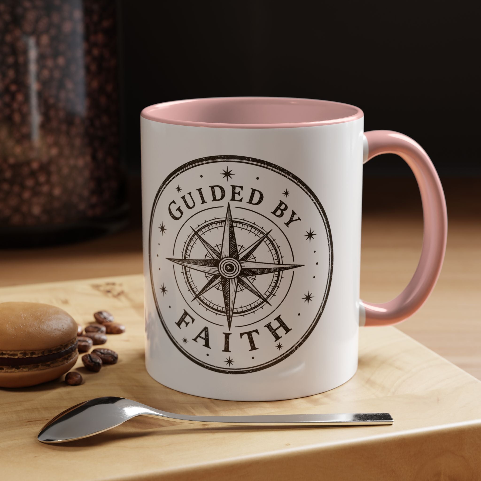 Inspirational ceramic accent coffee mug featuring a compass design and “Guided by Faith” message with colorful handle and interior accents on a glossy white mug.