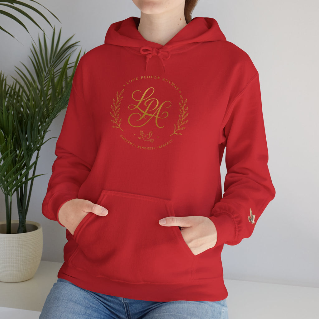 Inspirational Christian hoodie featuring elegant “Love People Anyway” script typography on a soft, cozy hooded sweatshirt designed to encourage kindness and compassion.