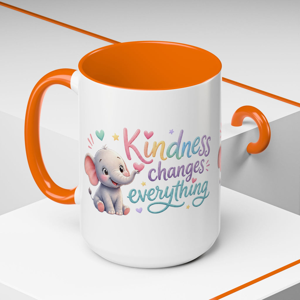 Cute ceramic coffee mug featuring a pastel baby elephant and the uplifting message “Kindness Changes Everything” with colorful accent handle and interior.