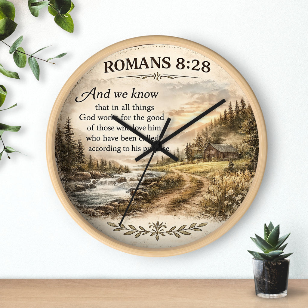 Inspirational Christian wall clock featuring Romans 8:28 scripture with a rustic cabin, flowing creek, and sunset landscape in warm countryside colors.