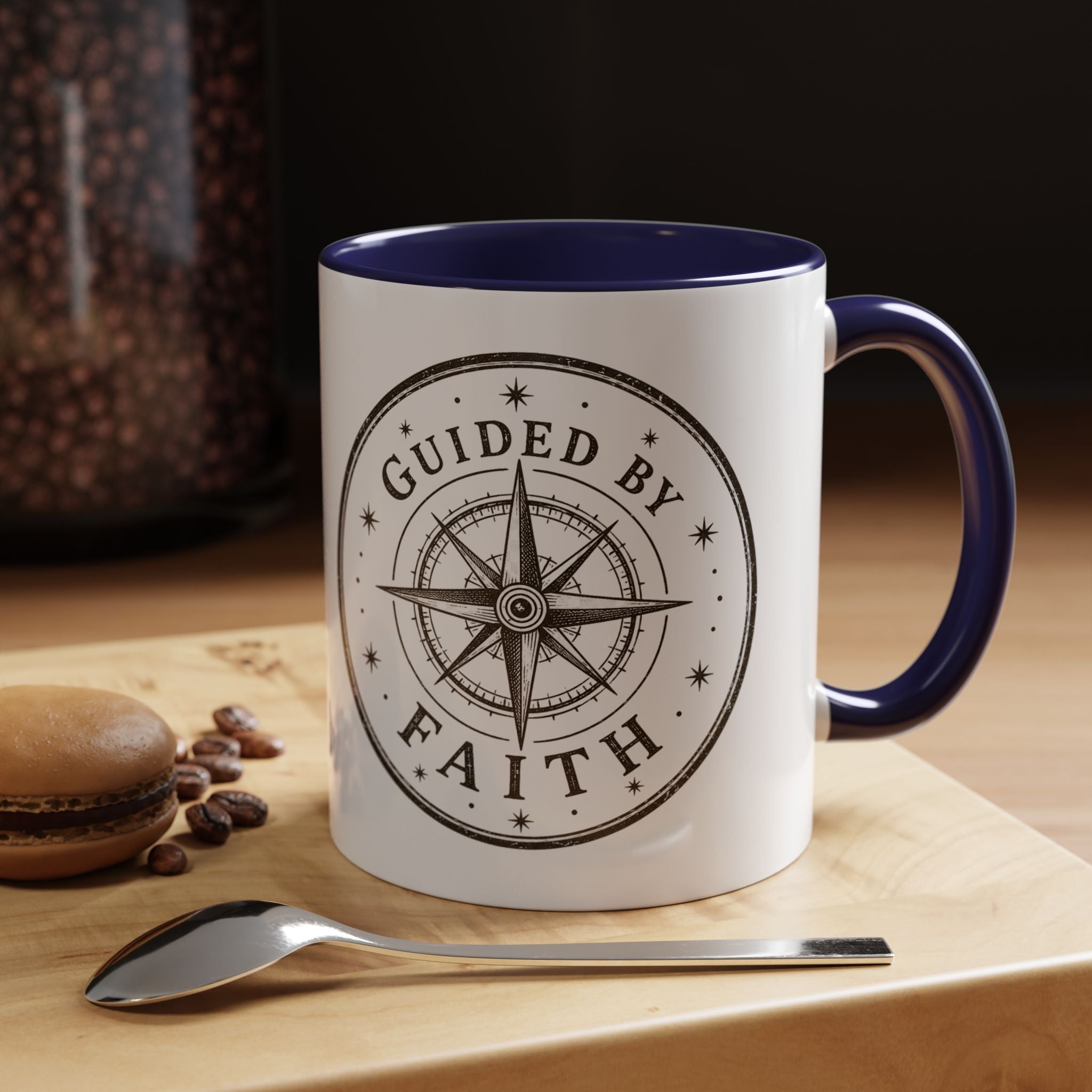 Inspirational ceramic accent coffee mug featuring a compass design and “Guided by Faith” message with colorful handle and interior accents on a glossy white mug.