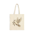 Cotton canvas tote bag featuring a vintage-style dove carrying an olive branch, symbolizing peace, hope, faith, and renewal in a rustic black-and-cream design.