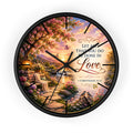 Inspirational Christian wall clock featuring a flower-lined lakeside sunrise scene with 1 Corinthians 16:14 scripture about doing all things in love.