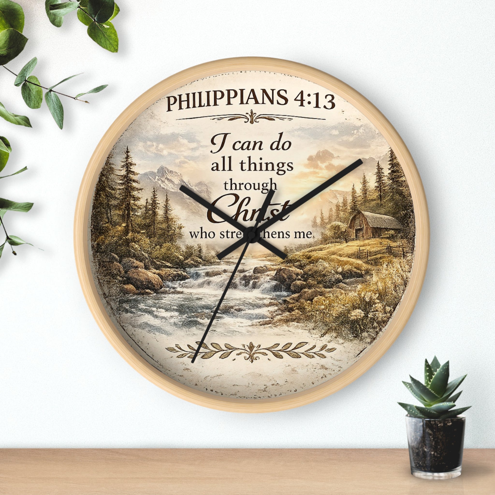 Inspirational Christian wall clock featuring Philippians 4:13 with a rustic cabin, flowing river, pine trees, and peaceful countryside landscape in warm vintage tones.