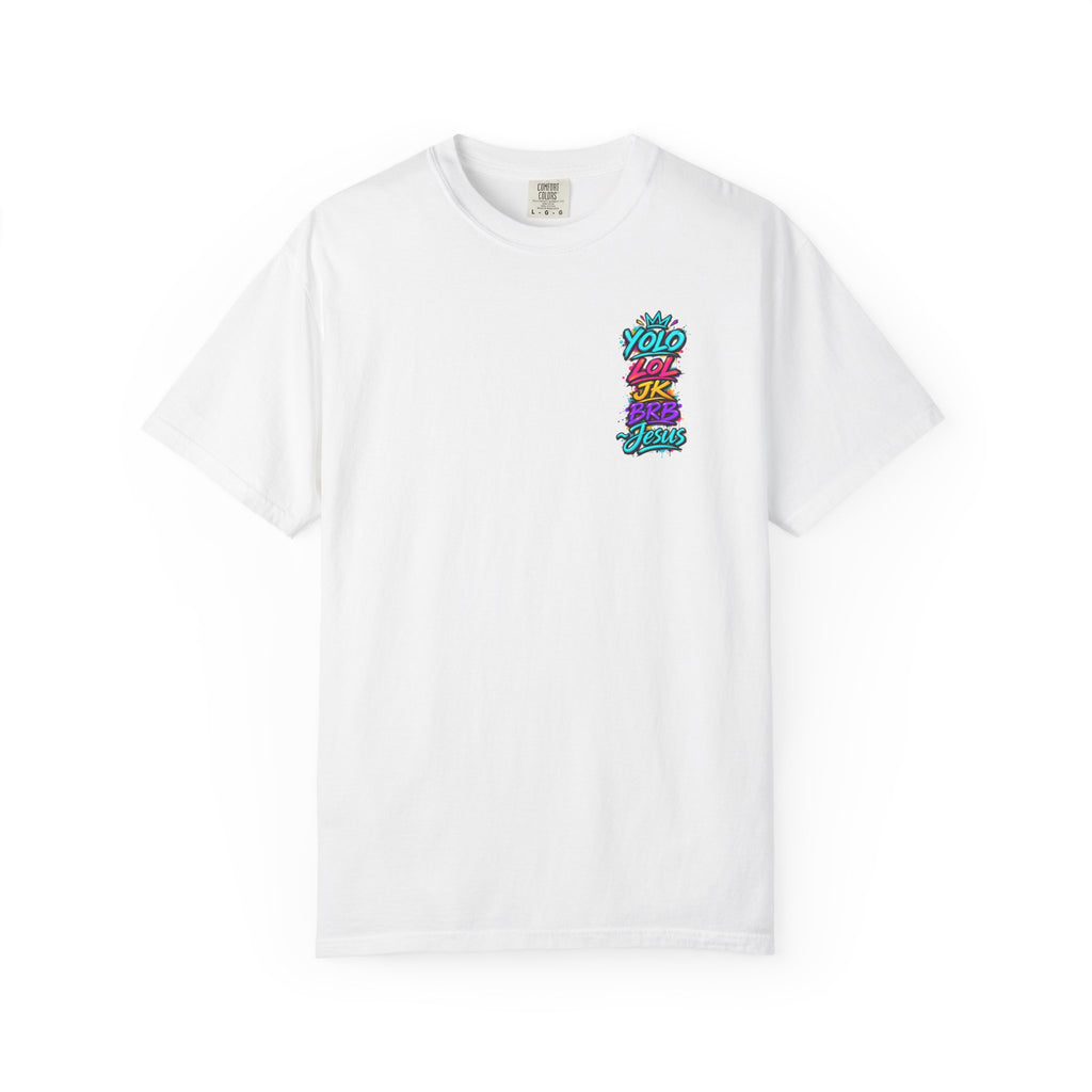 Front view of a white Comfort Colors 1717 T-shirt featuring a small neon YOLO LOL JK BRB Jesus graffiti design on the left chest, with turquoise, pink, yellow, and purple lettering and a crown accent.