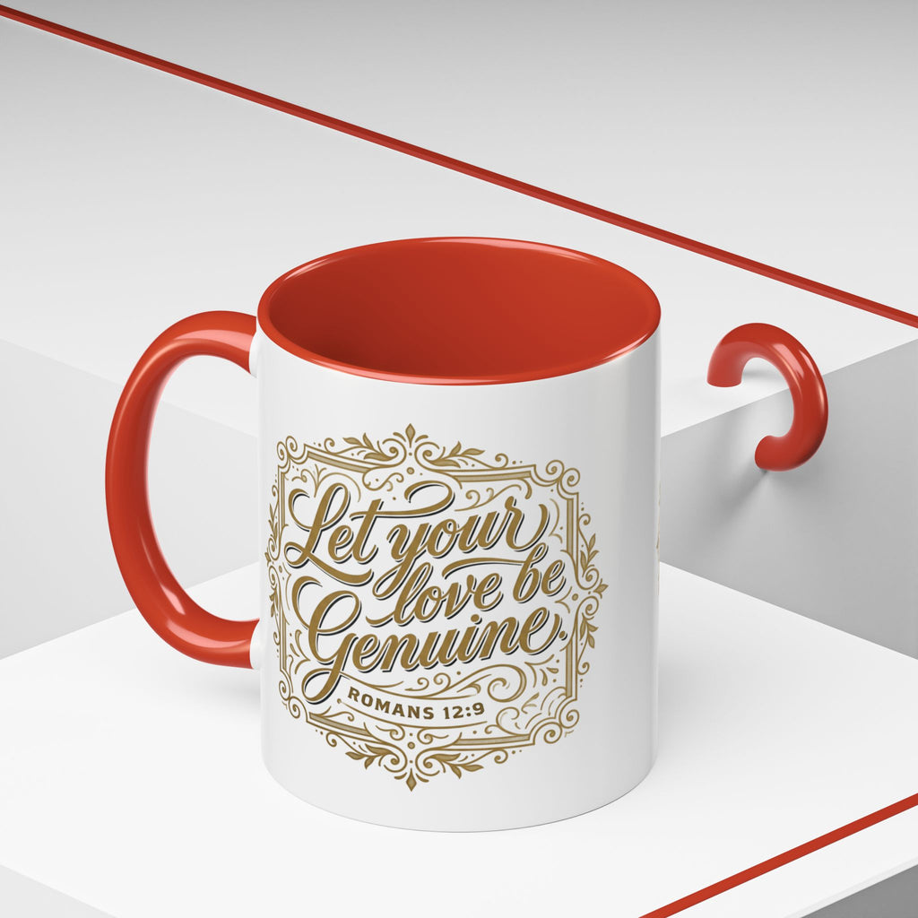 Inspirational ceramic accent coffee mug featuring Romans 12:9 and the message “Let Your Love Be Genuine” in elegant gold script with decorative flourishes and black accent handle and interior.