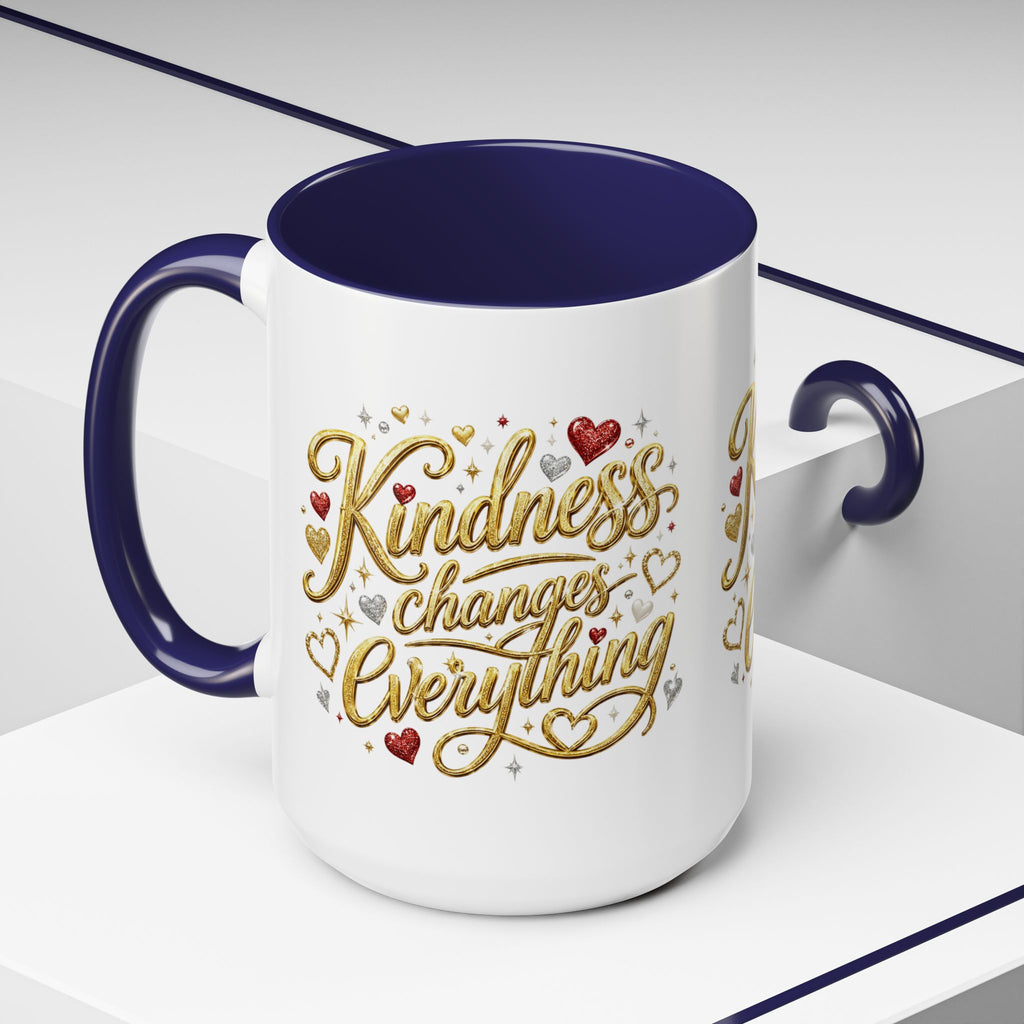 Inspirational ceramic coffee mug featuring the hand-lettered message “Kindness Changes Everything” with gold flourishes, hearts, and colorful accent handle and interior.