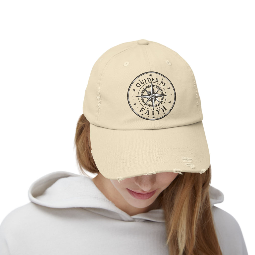 Vintage distressed Christian baseball cap featuring a compass emblem and the phrase “Guided by Faith” on a soft low-profile cotton twill hat.