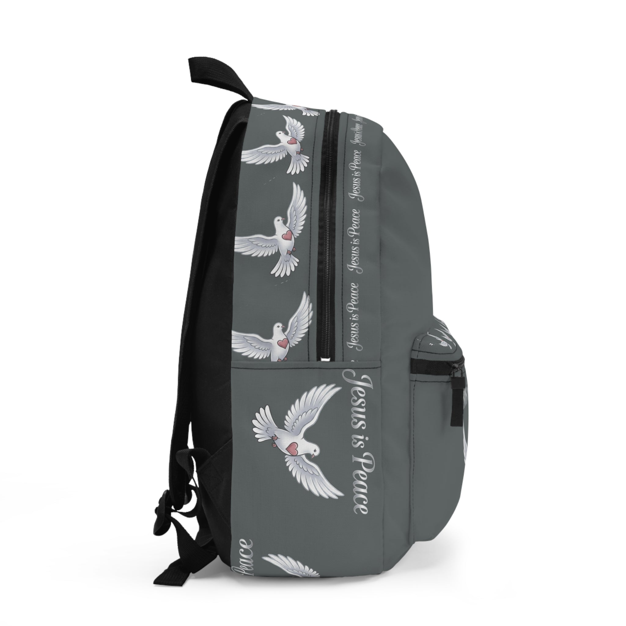 Gray Christian backpack featuring a white dove carrying a heart beneath the words "Jesus Is Peace," with multiple zippered compartments and padded shoulder straps.