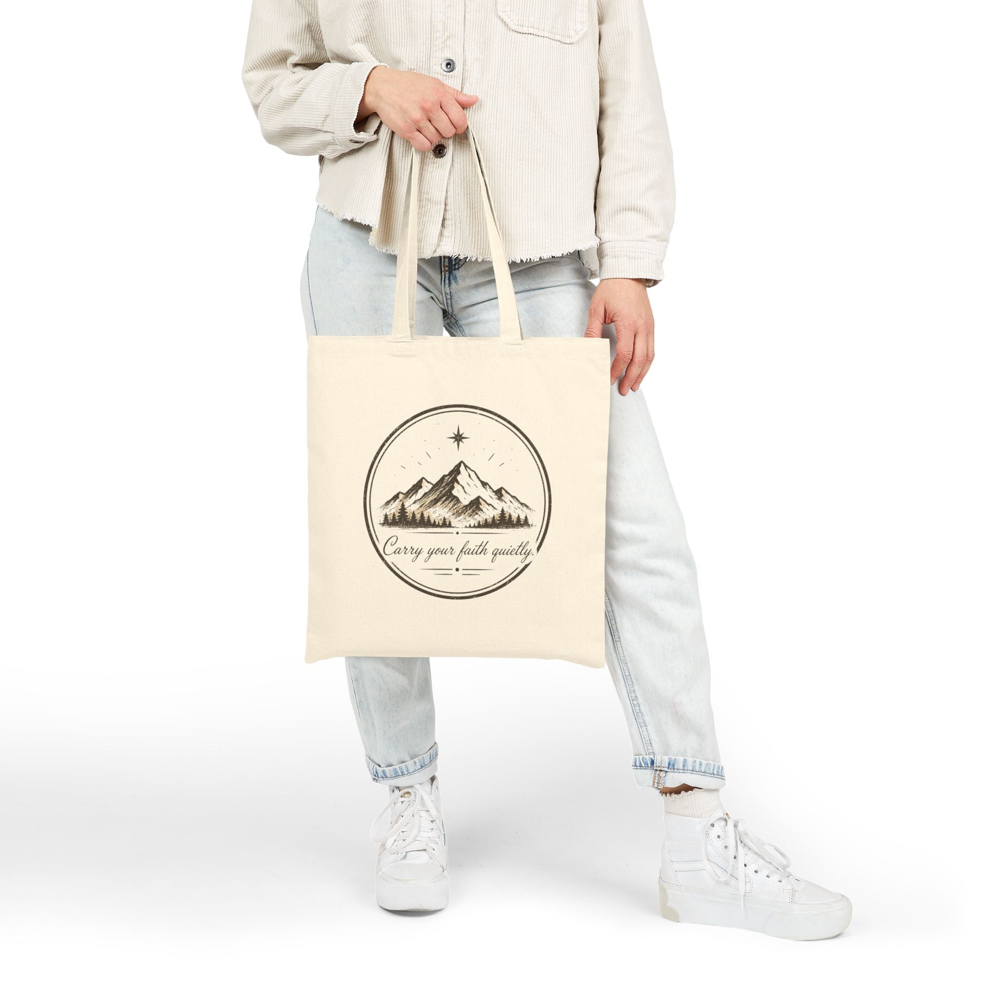 Rustic cotton canvas tote bag featuring mountain peaks, pine trees, a guiding star, and the Faith & Freedom Creations tagline “Carry Your Faith Quietly” in a vintage outdoor-inspired design.
