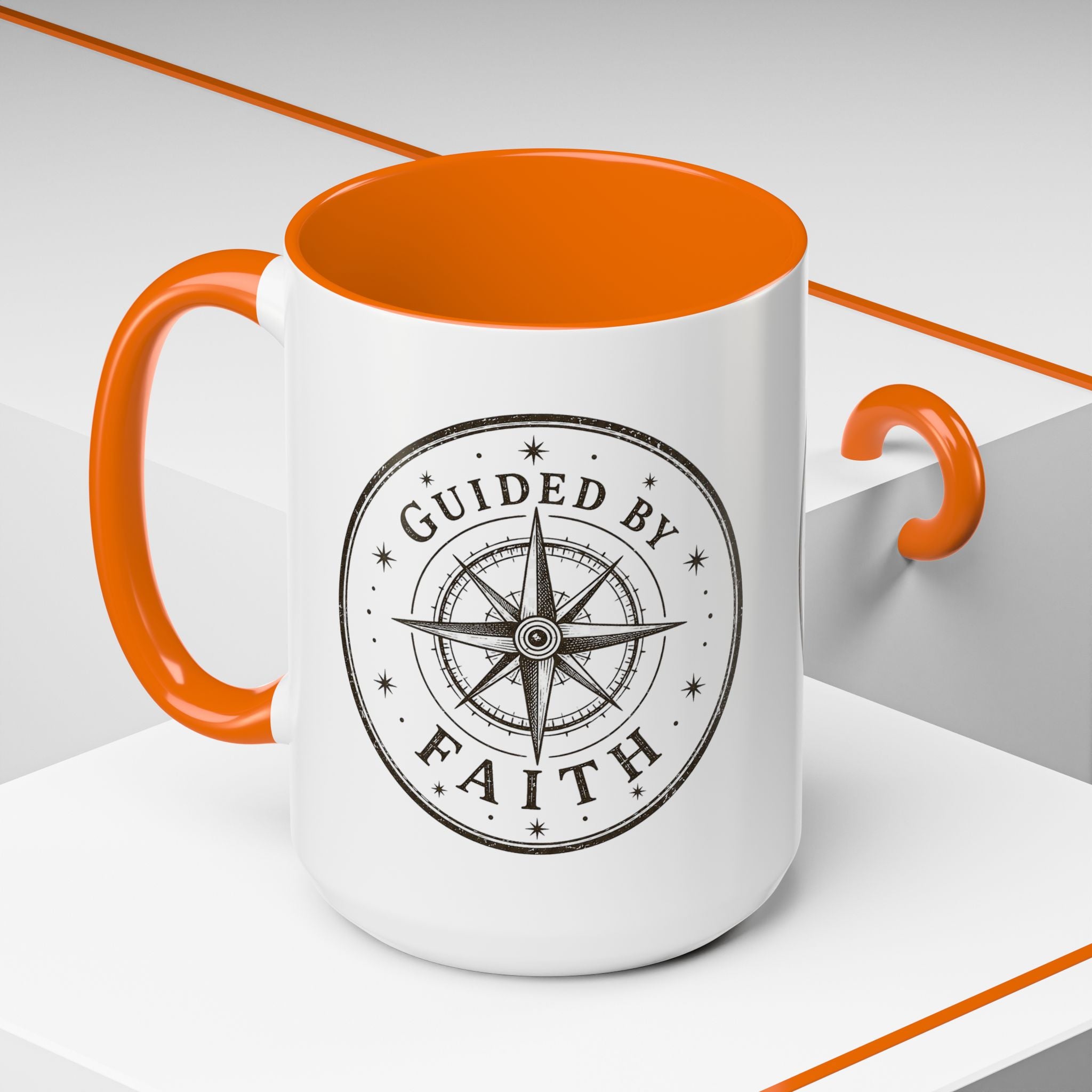 Inspirational ceramic accent coffee mug featuring a compass design and “Guided by Faith” message with colorful handle and interior accents on a glossy white mug.
