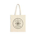 Rustic cotton canvas tote bag featuring a vintage compass rose surrounded by stars and the words "Guided by Faith" in a distressed black-and-cream design.