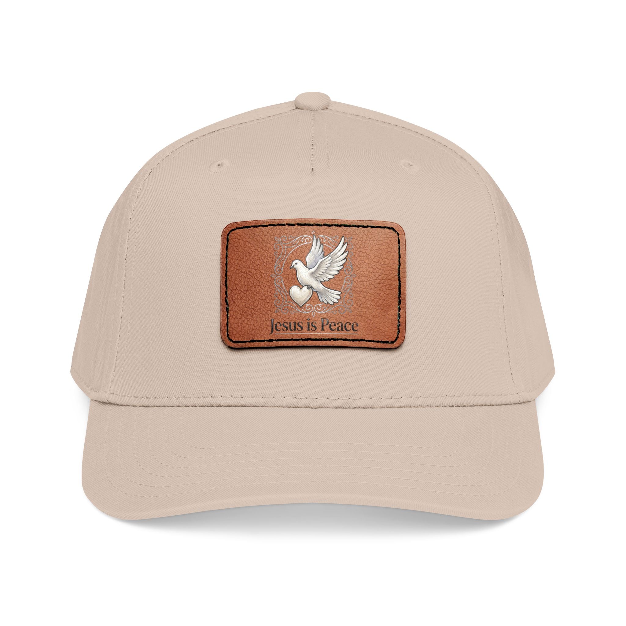 Beige Christian baseball cap featuring a brown leather patch with a white dove carrying a heart and the words "Jesus Is Peace."