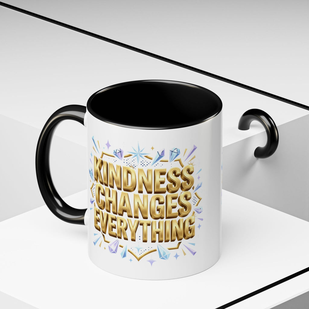 Inspirational ceramic accent coffee mug featuring “Kindness Changes Everything” in elegant gold script with sparkles and colorful accent handle and interior.