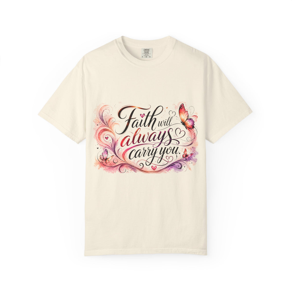 An off-white short-sleeve t-shirt with a colorful graphic on the chest that reads 'Faith will always carry you' in cursive script, decorated with pink and purple watercolor swirls and butterflies.