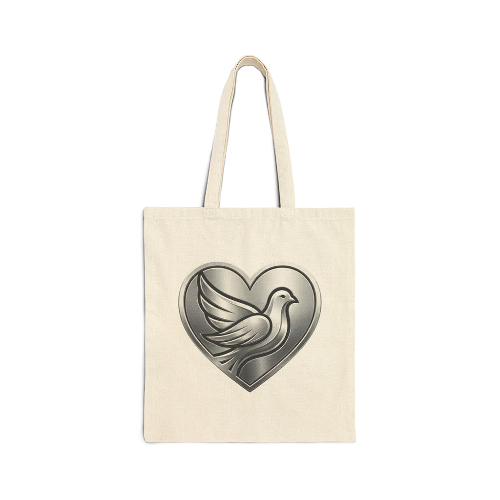 Cotton canvas tote bag featuring a silver dove inside a heart design, symbolizing peace, love, faith, hope, and encouragement in an elegant minimalist style.