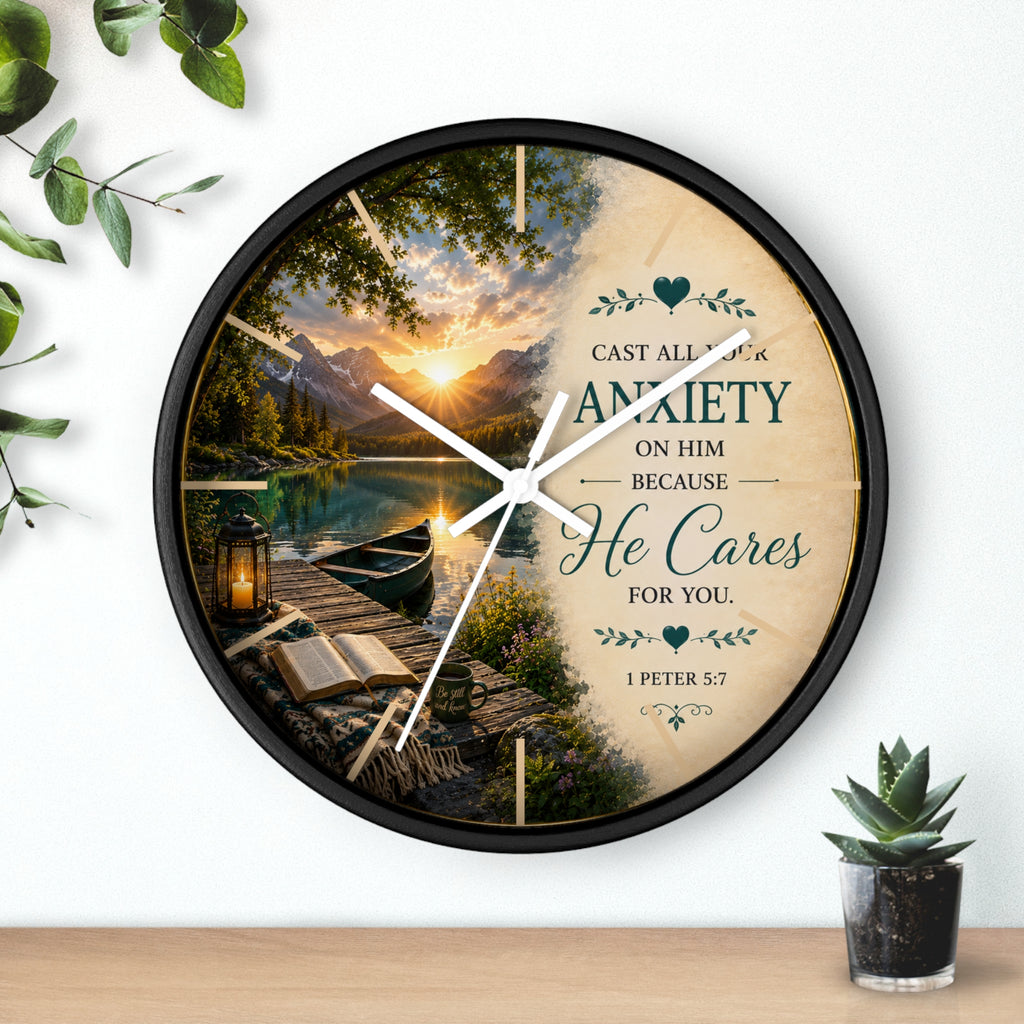Inspirational Christian wall clock featuring a peaceful lakeside sunrise with a dock, canoe, and 1 Peter 5:7 scripture about casting anxiety on Him.
